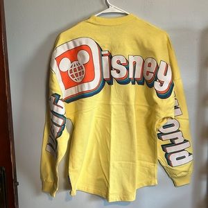 Walt Disney World Retro Yellow spirit jersey. Size XS. NWT.